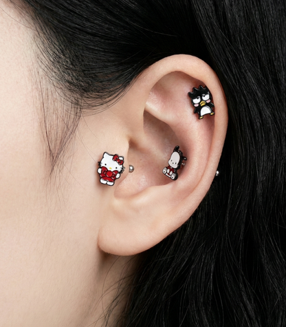 Full Sanrio ear stack featuring Hello Kitty, Badtz-Maru, and Chococat character piercings