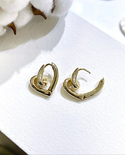 Gold twisted love knot heart earrings shown open and closed, clicker mechanism detail