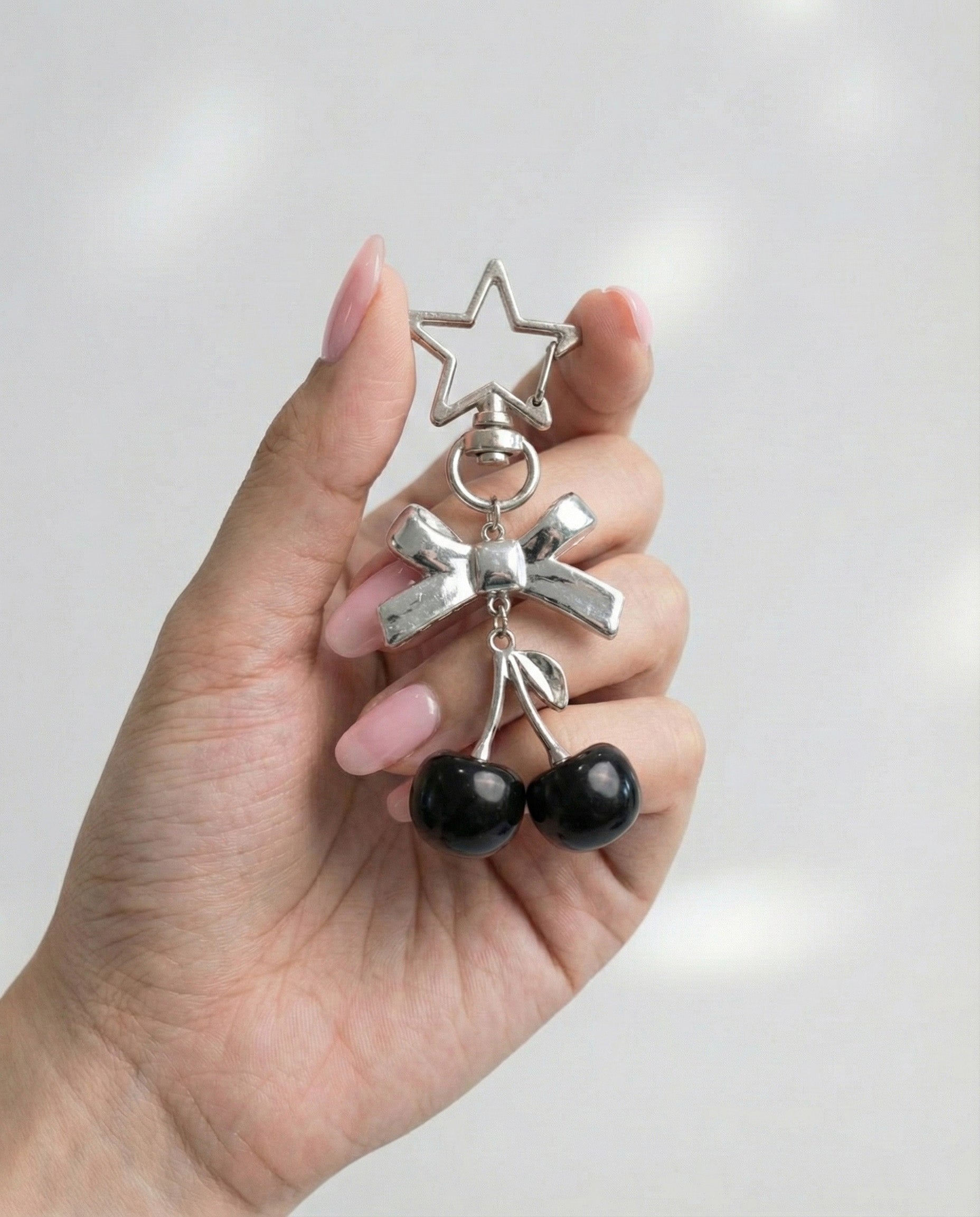 Black cherry bow keychain in hand silver star clasp coquette bag charm Y2K