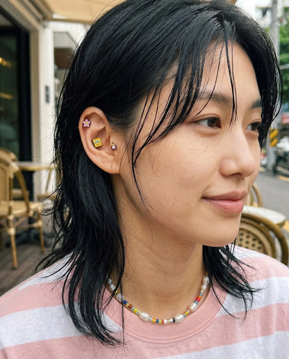 Curated ear stack inspo — 8ttitto8 character piercing set with pearl bead necklace, Y2K kidcore aesthetic multi-piercing look