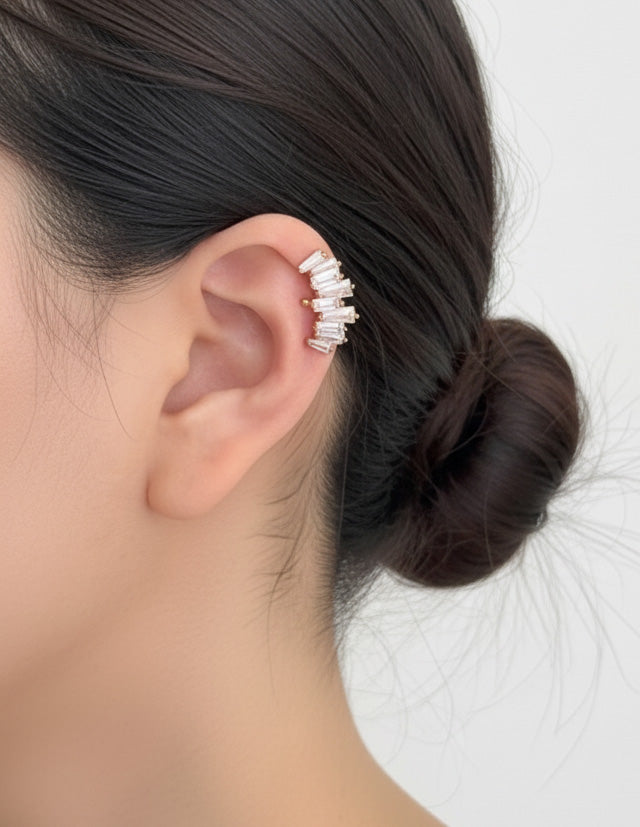 Gold baguette-cut cubic zirconia ear cuff worn on the upper ear, brass material, handmade in Korea.