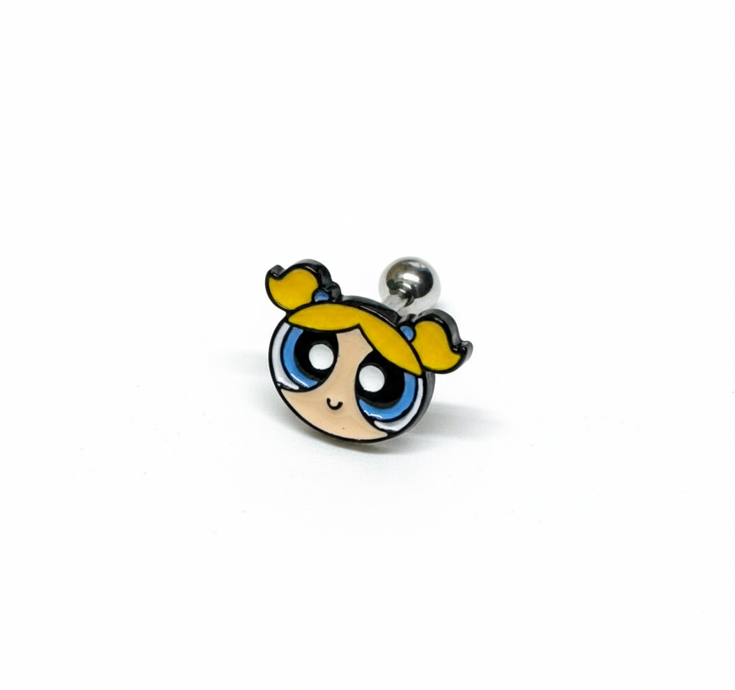 close-up of a Powerpuff Girls–inspired yellow-haired character barbell earring on a white background.