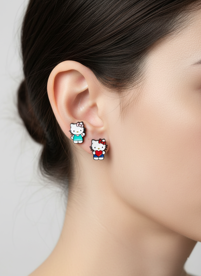 Hello Kitty earrings styled as mismatched studs with one holding a heart and one in mint dress, worn on lobe and helix.