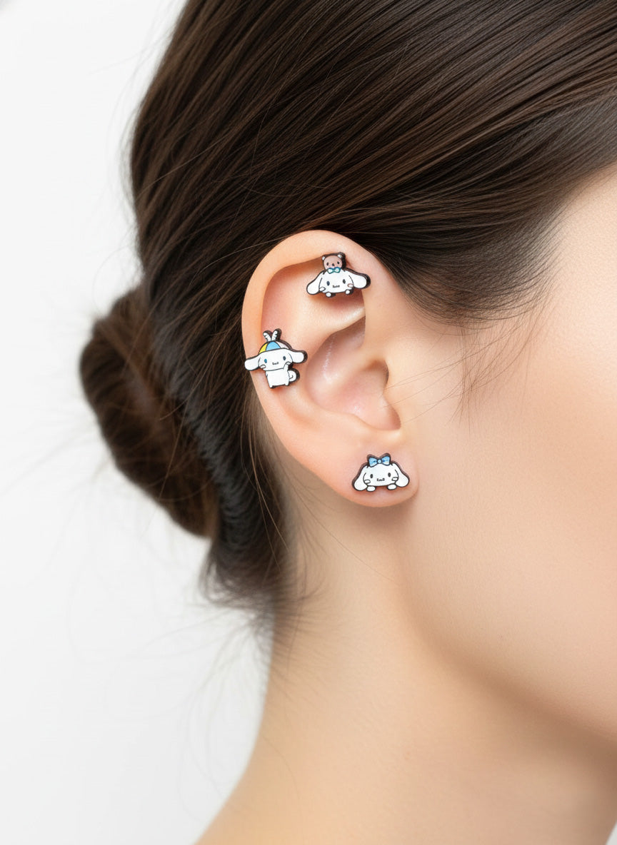 Cinnamoroll cartilage piercing layered look with 3 piercings on helix and lobe, angelcore aesthetic styling
```
