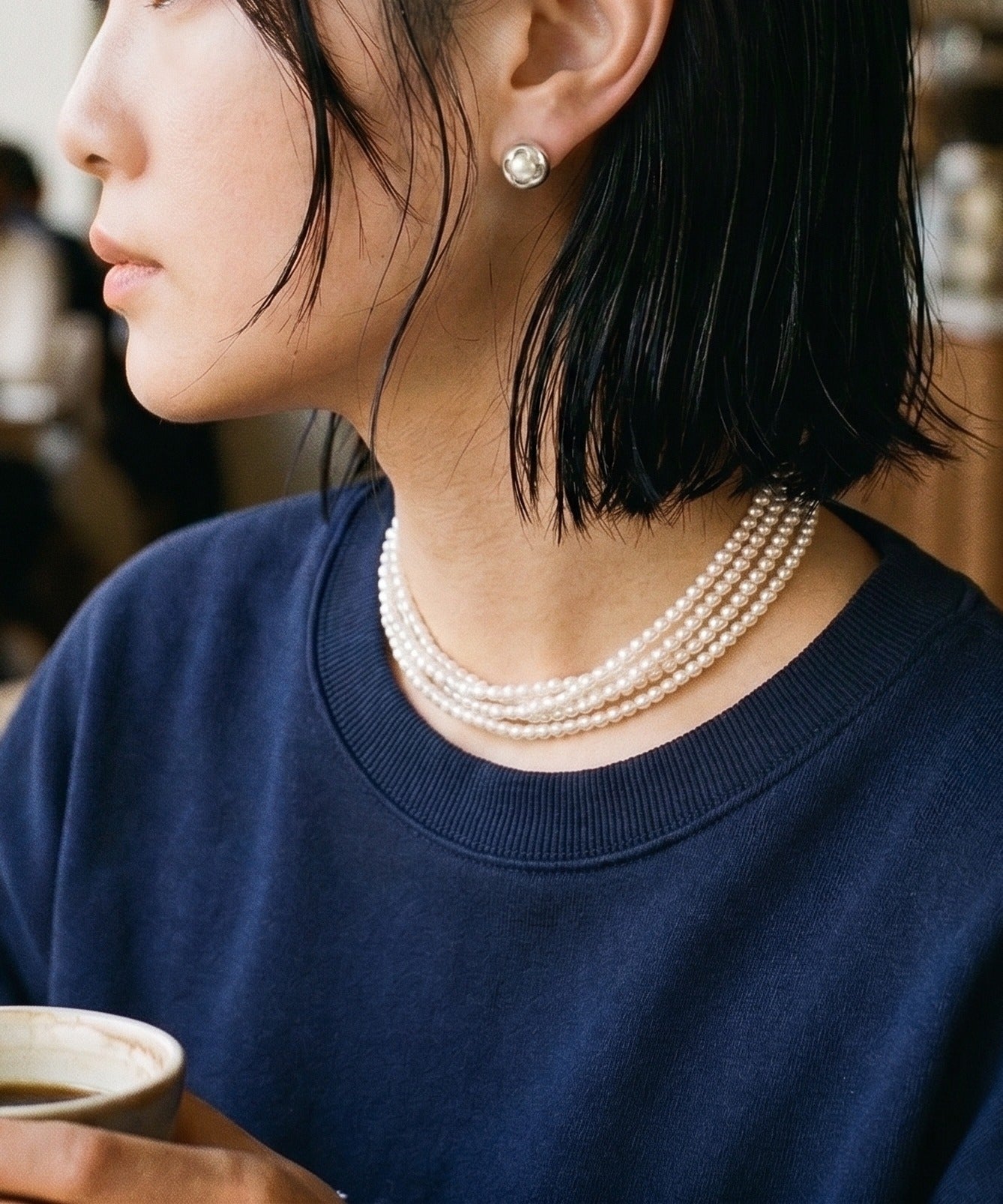Silver 3D Clover Swarovski Pearl Studs flat lay — Quiet Luxury in earring form. Pair with your pearl choker for the full Mixed-metal Pearl vibe.