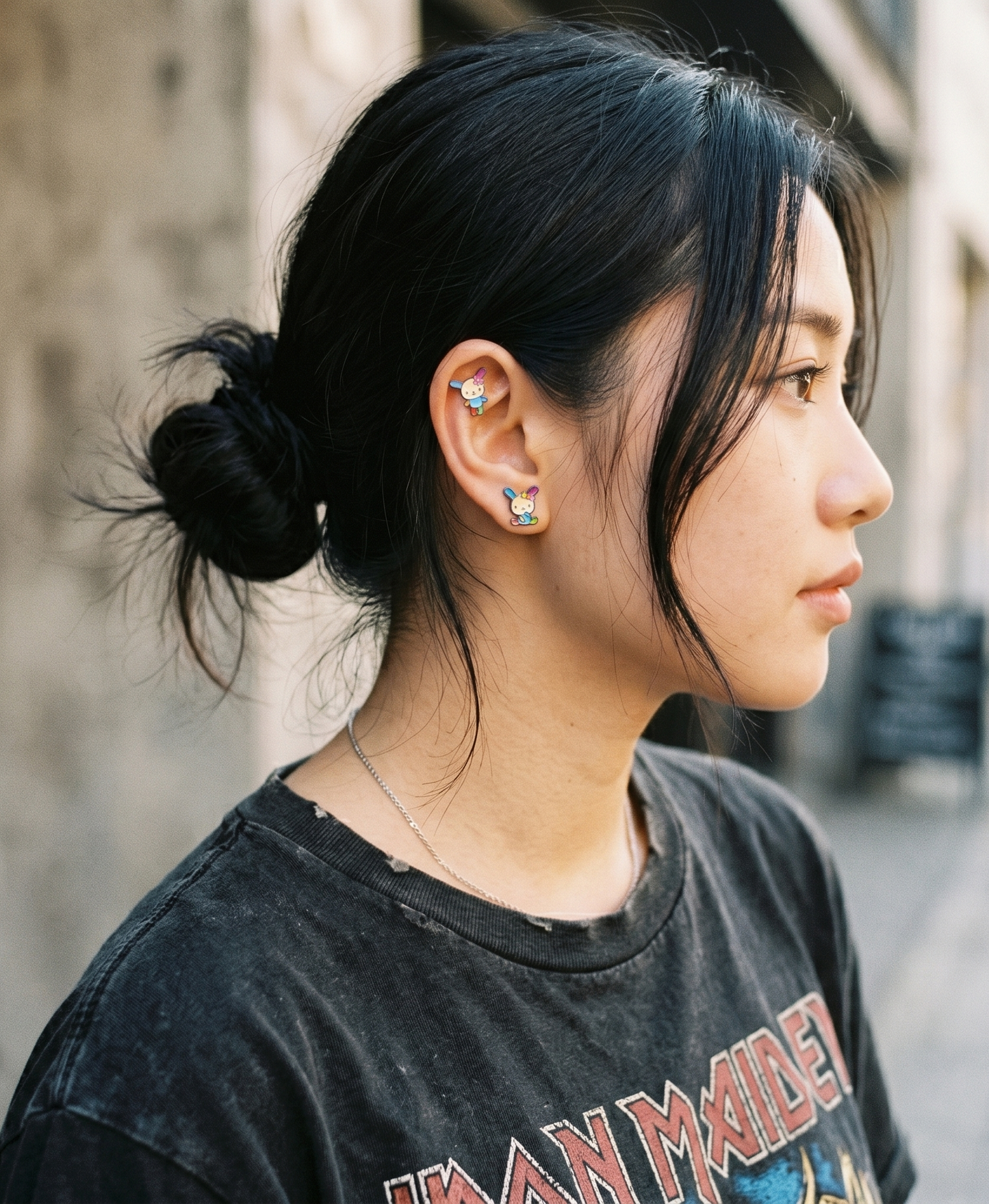 Gen Z ear curation — Usahana enamel studs on conch and lobe piercing, Sanrio store backdrop, Y2K kidcore aesthetic by 8ttitto8