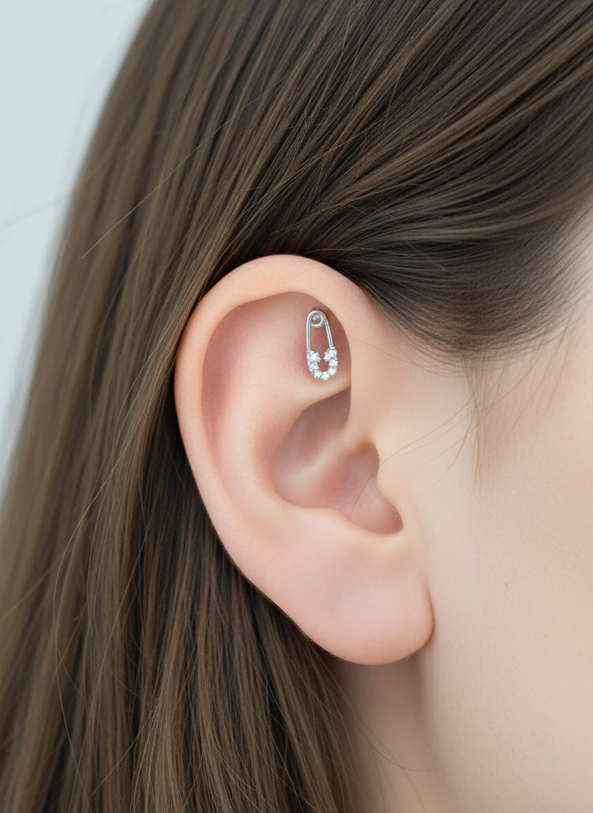 Minimal safety pin earring on ear