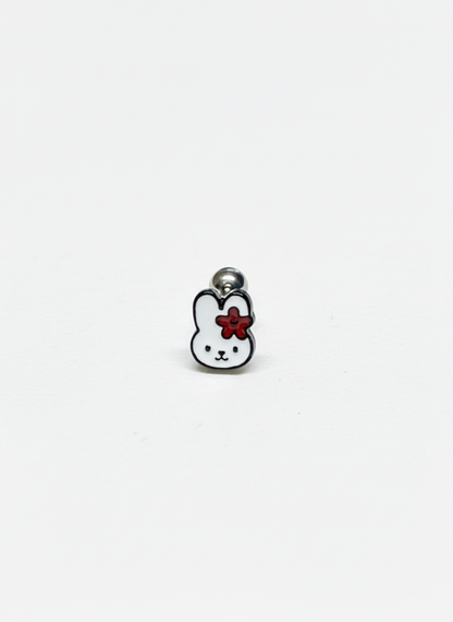 Close-up of a single barbell earring shaped like Miffy with a red flower on her ear, against a clean white background.