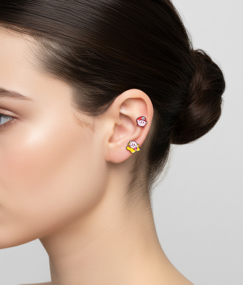 Pink Kirby inspired barbell earrings worn on ear, showing cute character design