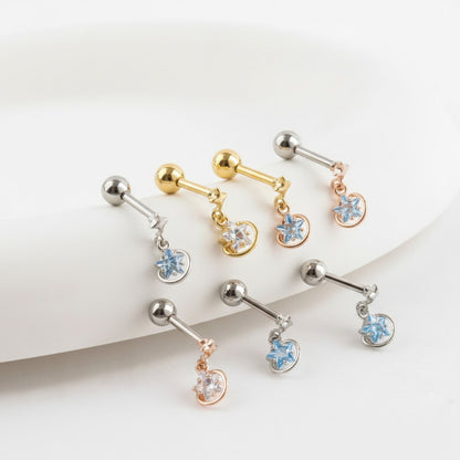 Assorted star and planet barbell earrings with clear and blue cubic zirconia stones in multiple metal tones.