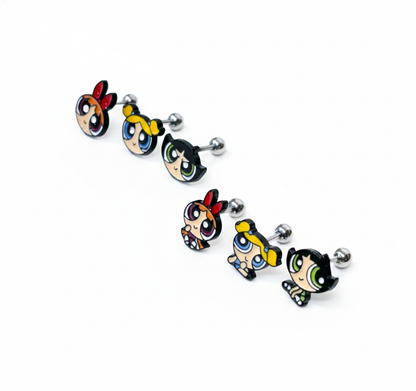 six assorted cartoon-inspired barbell earrings lined up on a white background, showing different colors and poses.