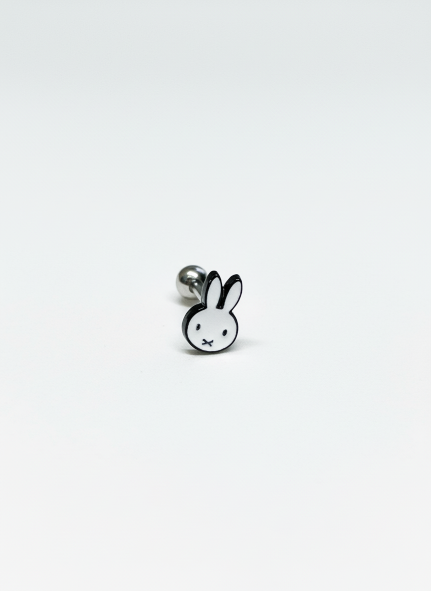 Stainless steel barbell earring with a clean black-and-white Miffy character face design, photographed against a plain white backdrop.