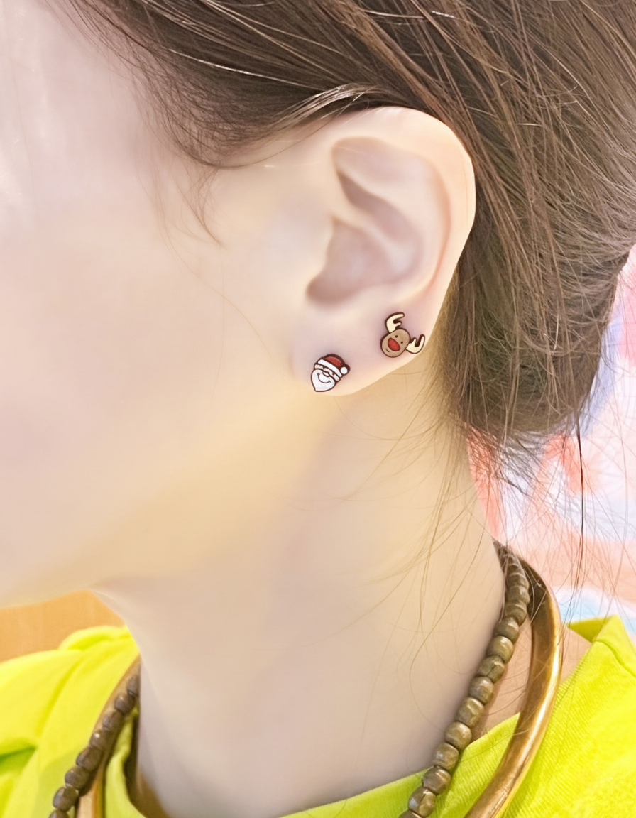 Angel Set mismatched earrings worn on ear – Santa and Reindeer