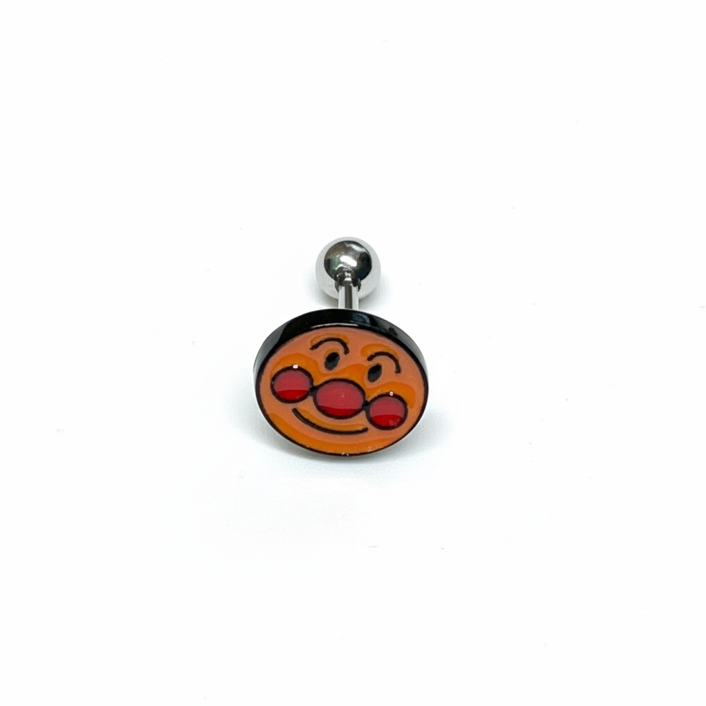 Single Anpanman face stud earring with red cheeks on white background.