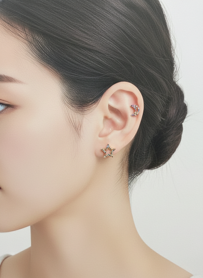 Woman wearing rainbow cubic zirconia moon helix piercing