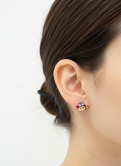 Crayon Shin-chan barbell earring worn on earlobe showing colorful enamel character design