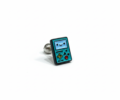 Adventure Time BMO enamel earring in teal, shaped like a handheld console with yellow, red, and green buttons