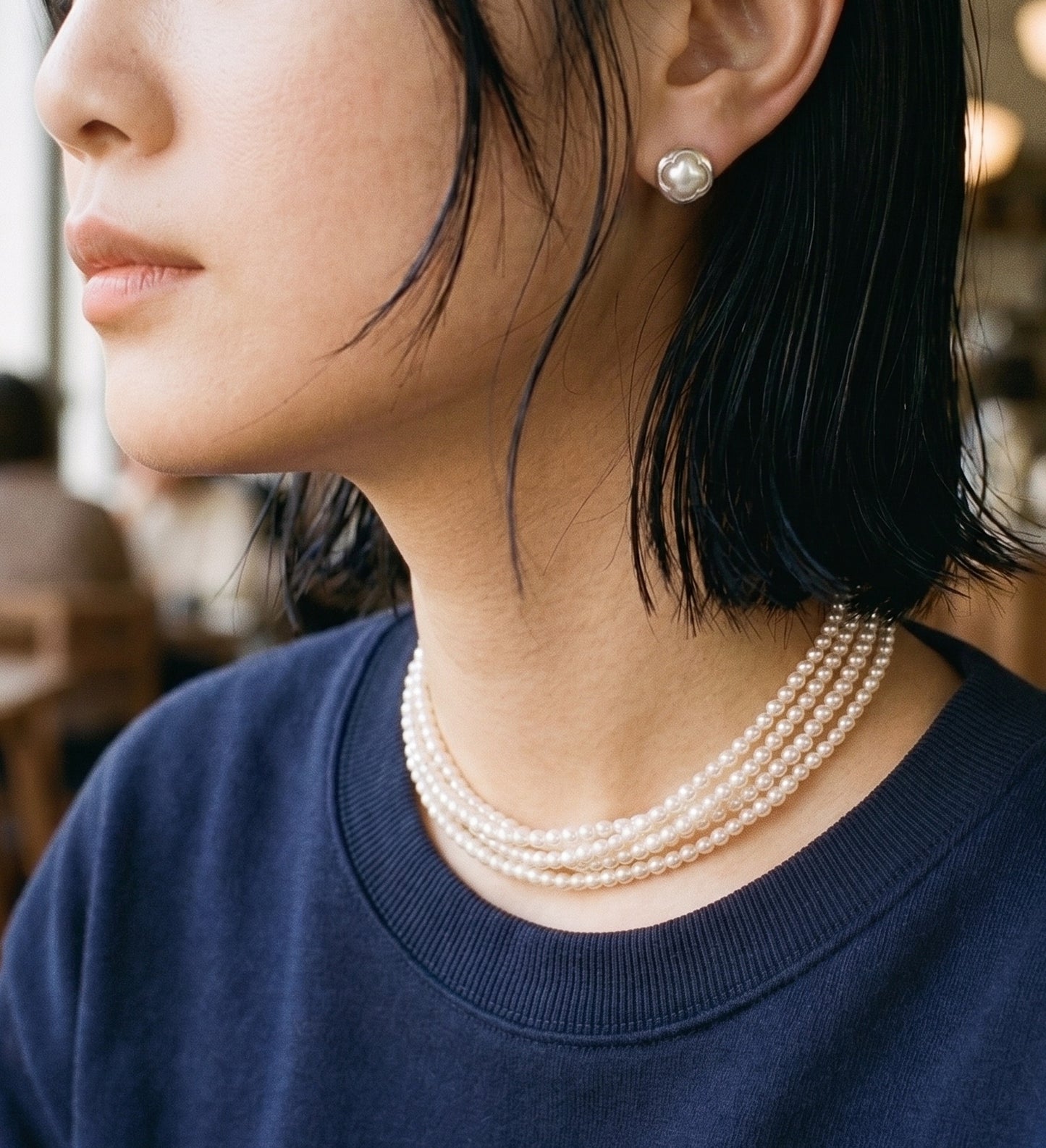 Downtown Girl aesthetic featuring silver clover studs and stacked 5-Row pearl necklace — the Sporty Chic formula.