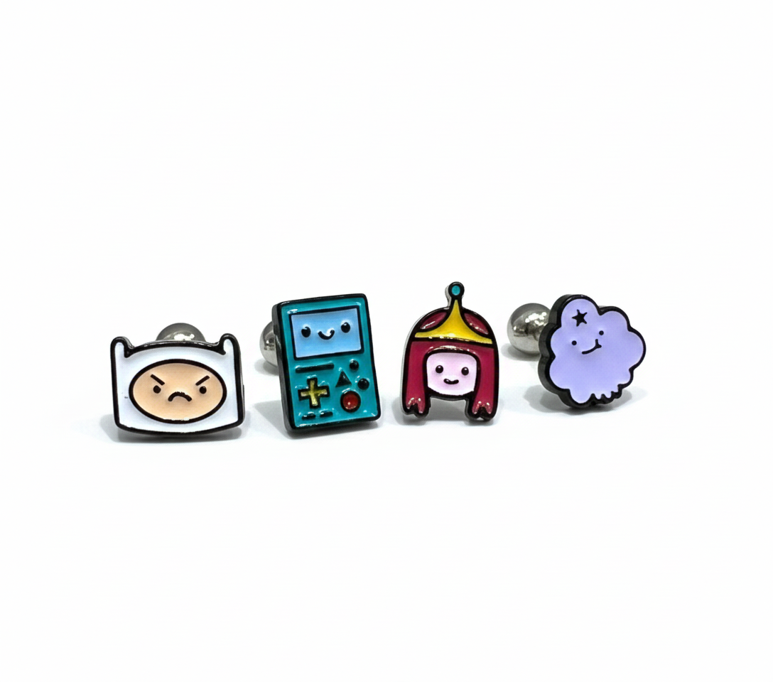 Four Adventure Time character earrings lined up: angry Finn, BMO, Princess Bubblegum, and Lumpy Space Princess