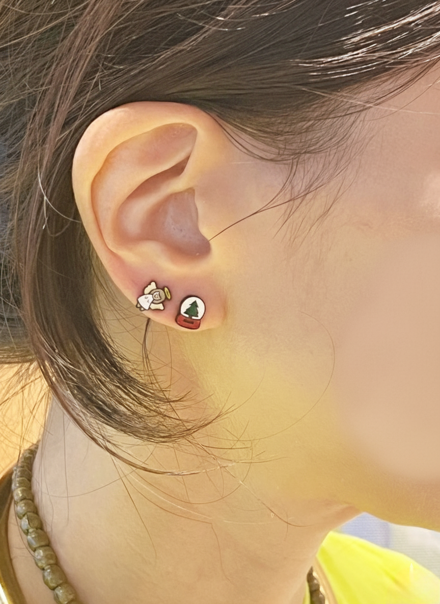 Angel & Snowglobe studs styled on ear
