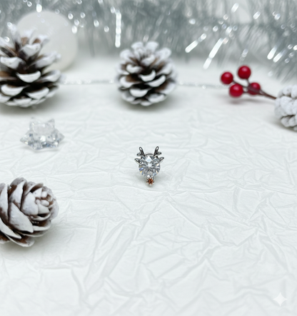 Reindeer barbell-ball earring macro — clear heart-shaped cubic zirconia with tiny brown nose accent