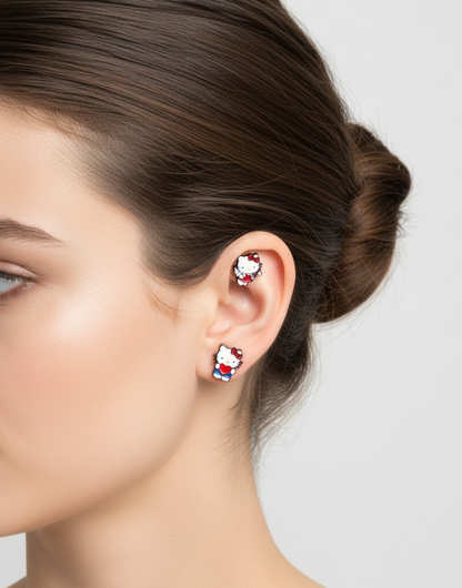 Red heart Hello Kitty studs worn on both helix and lobe, styled on the left ear with hair pulled back