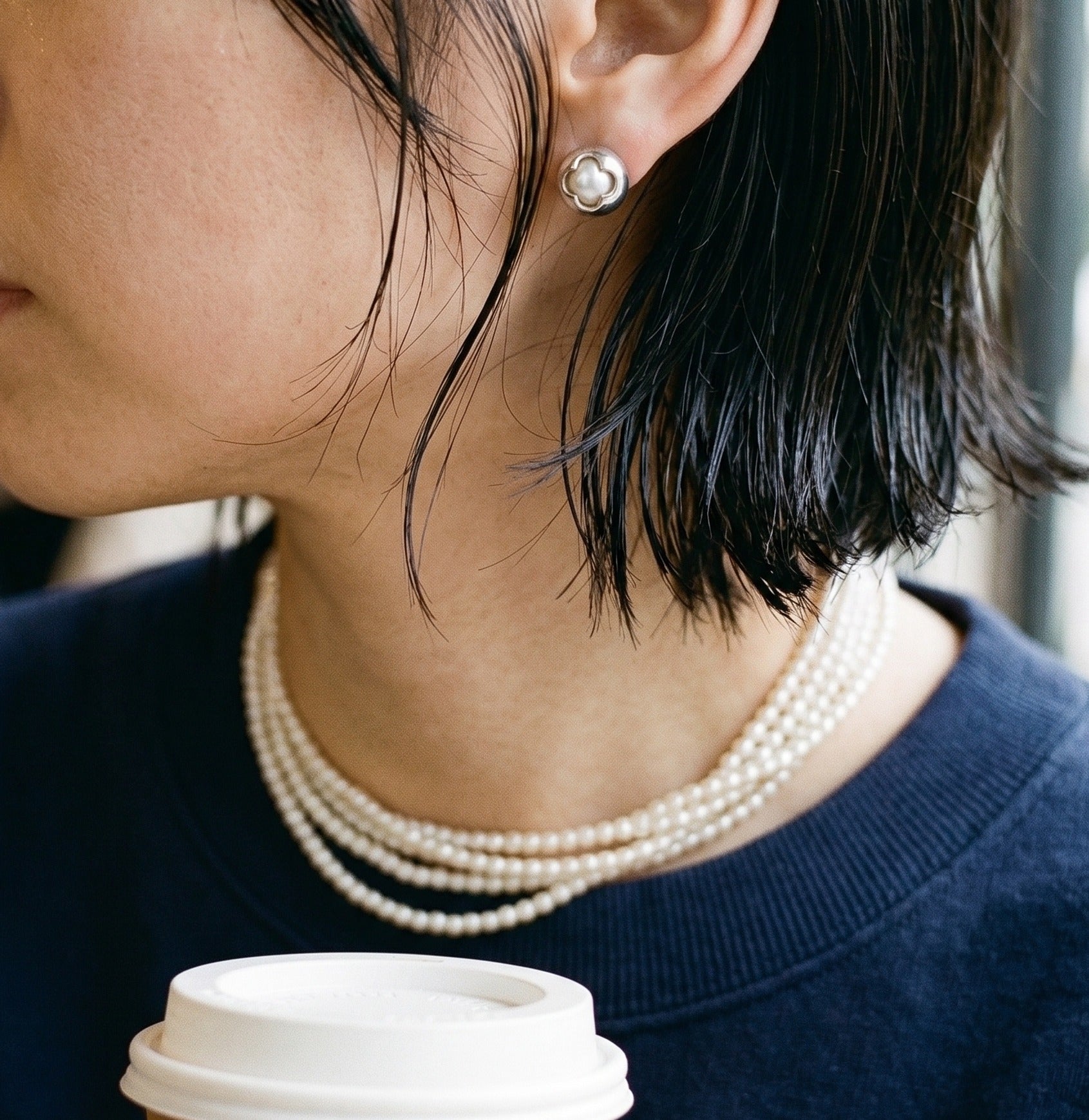 Pearl Choker Layering inspo — silver Clover Swarovski Pearl Studs with a stacked pearl necklace and navy sweatshirt. The Sporty Chic formula Pinterest keeps reposting.