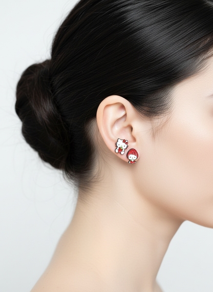 Strawberry-themed Hello Kitty earrings worn together for a matching fruity look on the ear