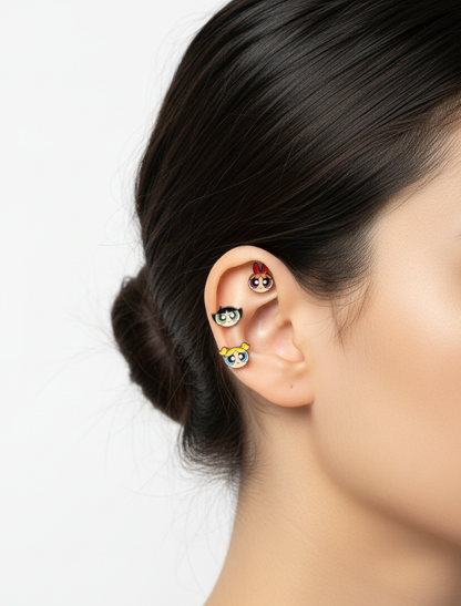 close-up of a black-haired cartoon-inspired barbell ball earring on a white background.