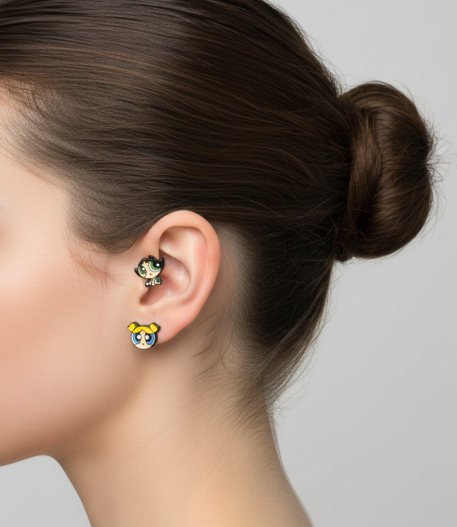 two Powerpuff Girls–inspired character barbell earrings worn on the ear, shown in a minimal side-profile studio shot