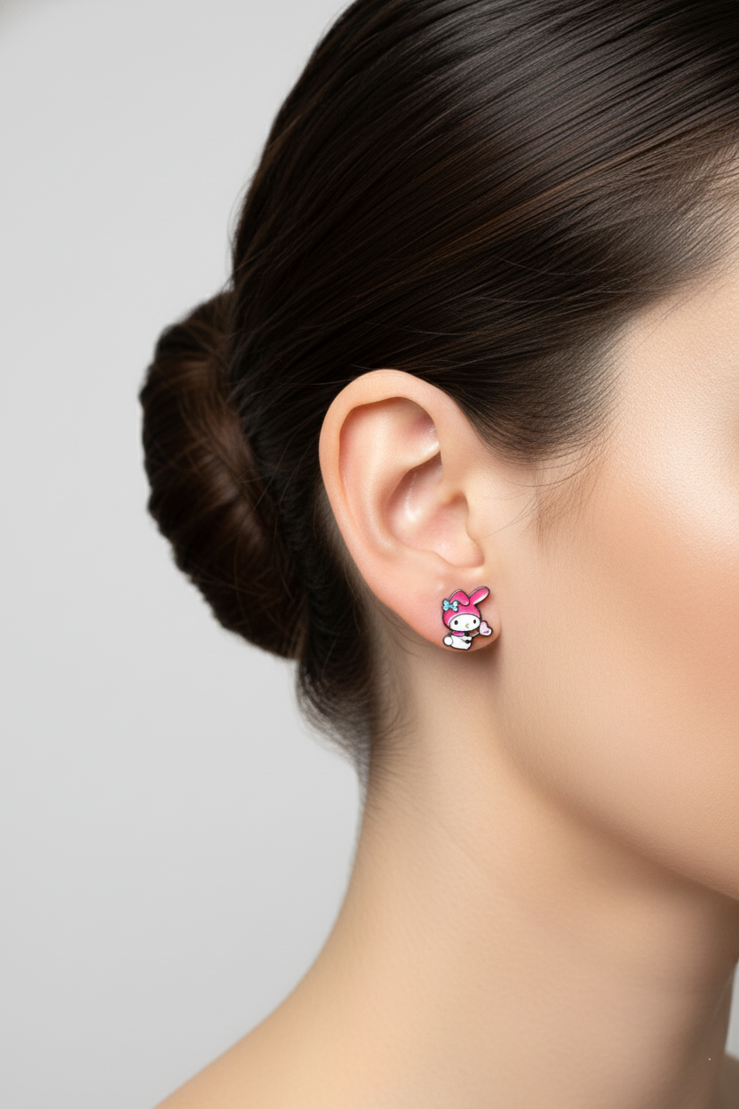 My Melody inspired earring on ear showing enamel detail