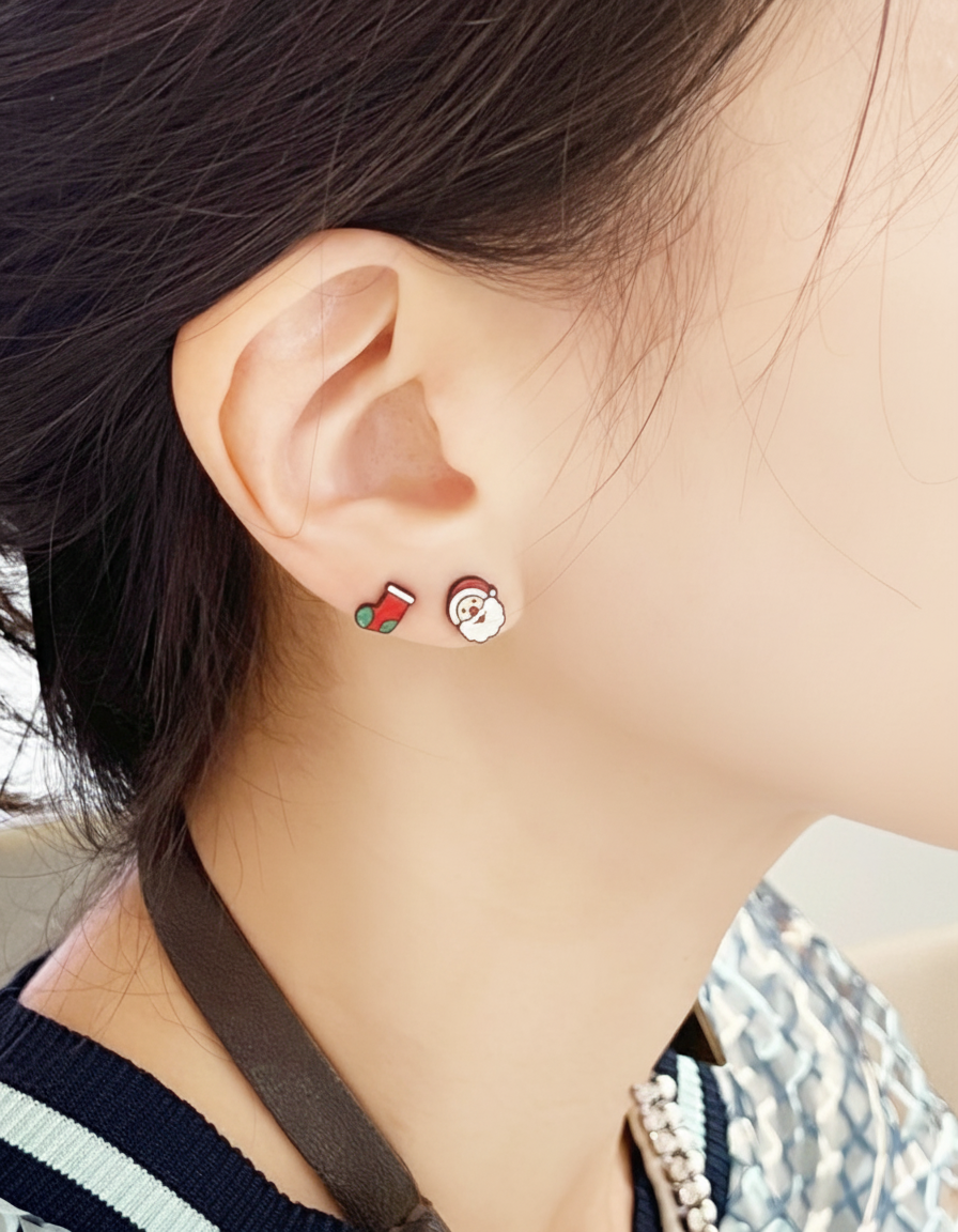 Stocking & Santa mismatched studs close-up