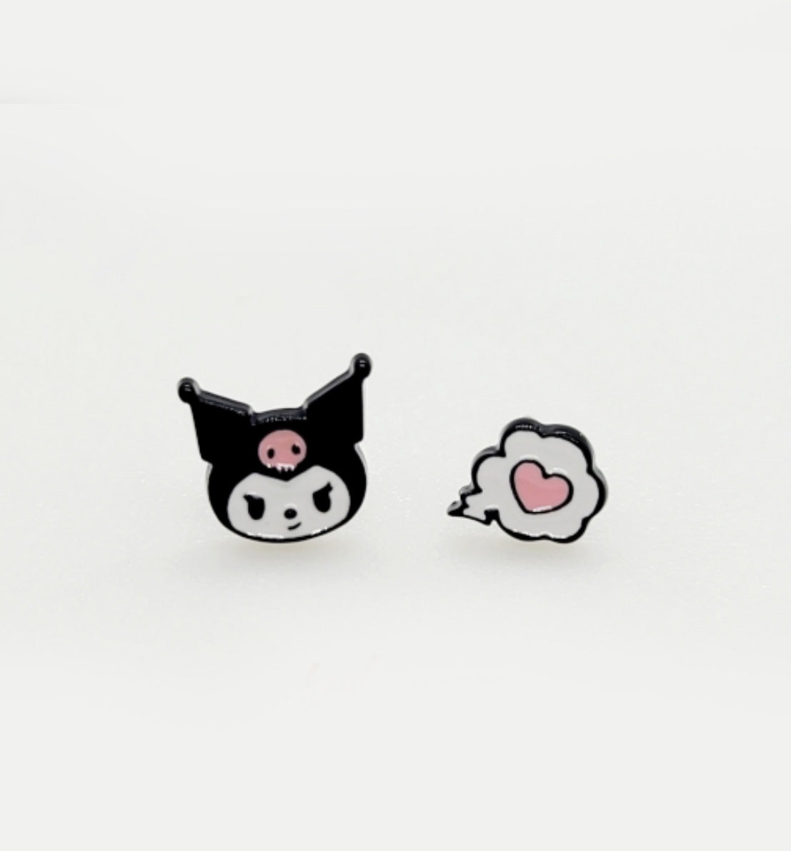 Kuromi character and pink heart cloud enamel stud earrings on white surface, black and pink cute mismatched design, Sanrio kawaii jewelry, 925 sterling silver posts, made in Korea