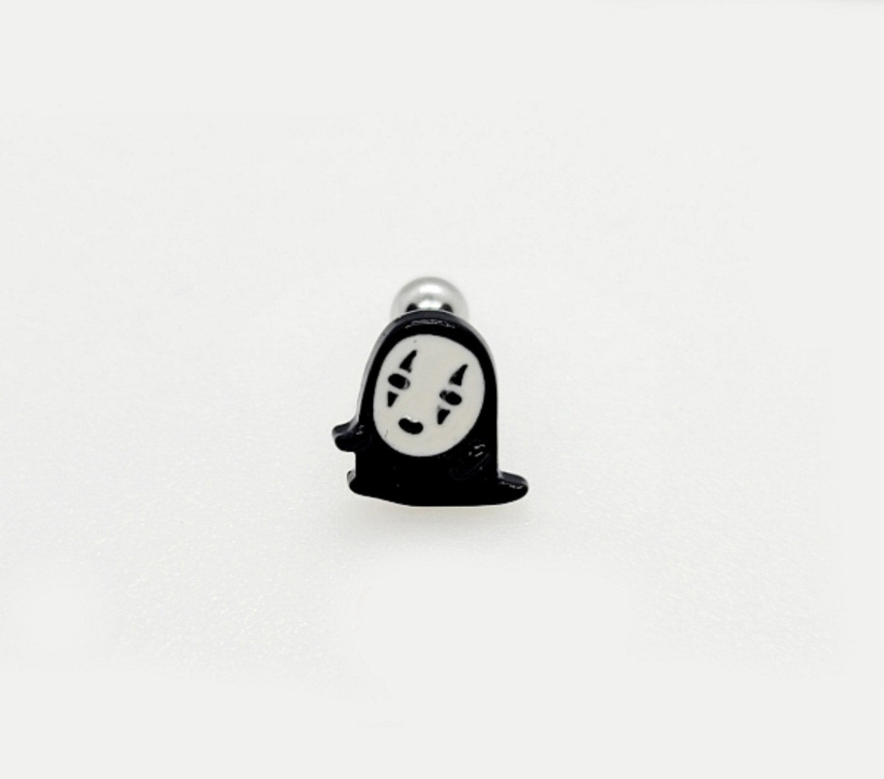  Individual product shot of No-Face holding red heart stud earring on white background.