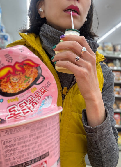 Geometric Silver Ring with Buldak Spicy Noodles - Korean lifestyle product photography showing ring on hand