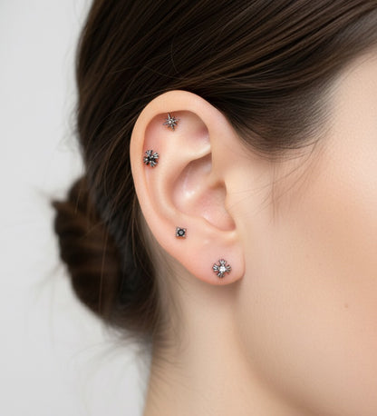 Side profile showing a single minimalist barbell on the inner cartilage. The ear is clean and unadorned, emphasizing a simple, modern vibe.