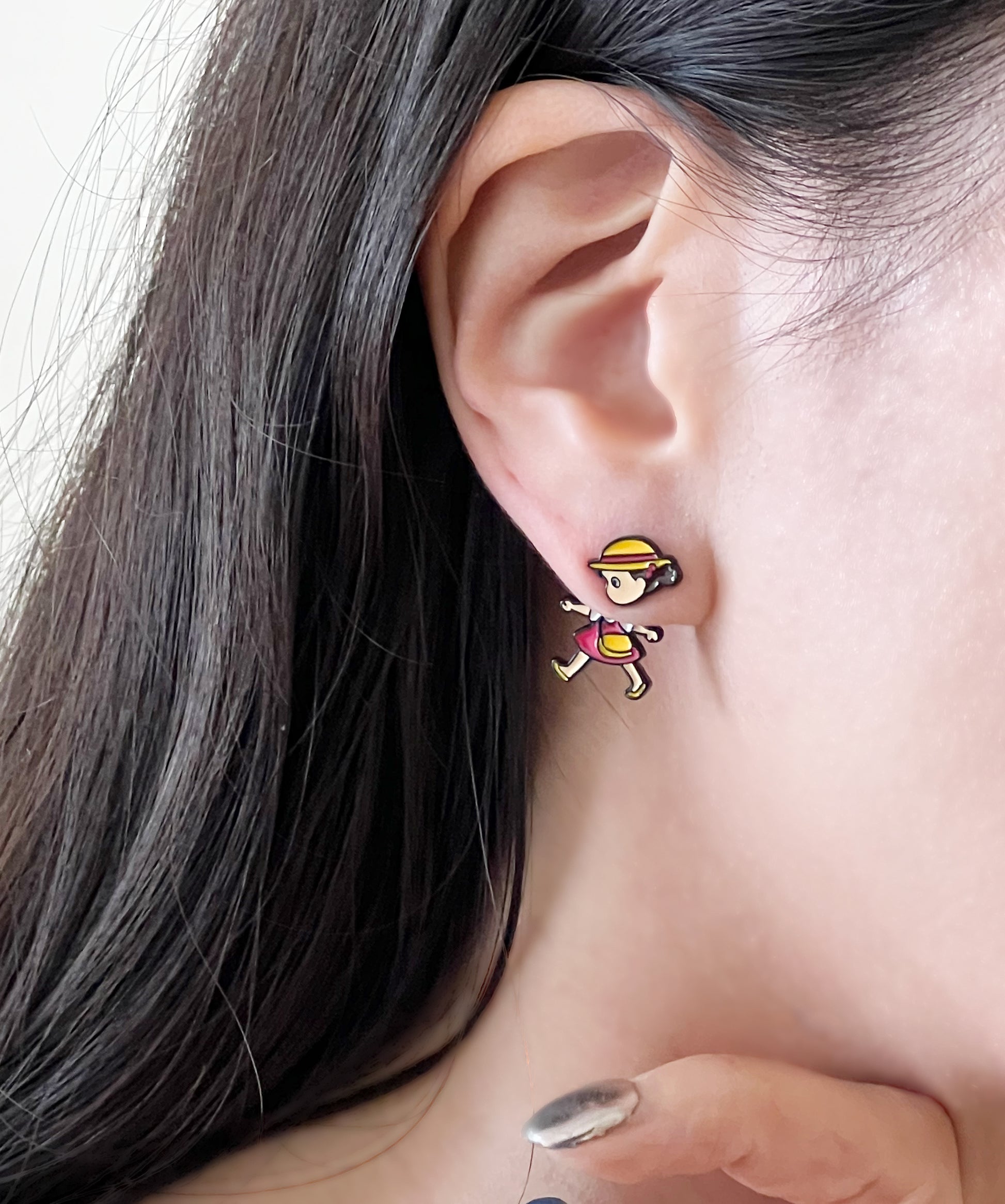Close-up of Mei character earring worn on ear, handmade Studio Ghibli enamel stud jewelry