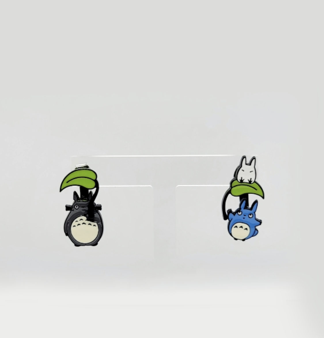 Ghibli inspired Totoro earring detail with green leaf