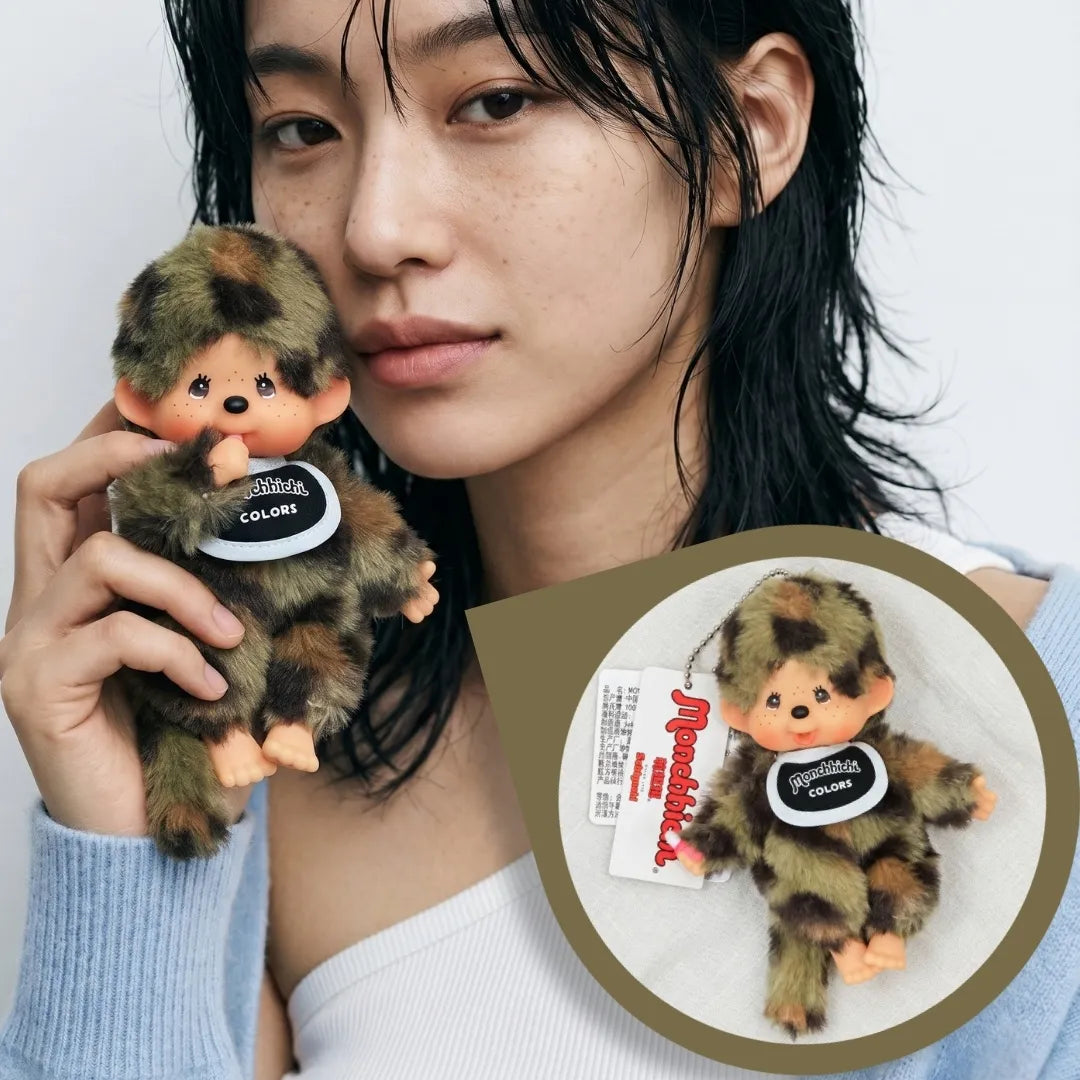 Editorial model close-up holding camo plush doll keychain 8ttitto8, soft grunge meets clean girl aesthetic, K-fashion bag charm.