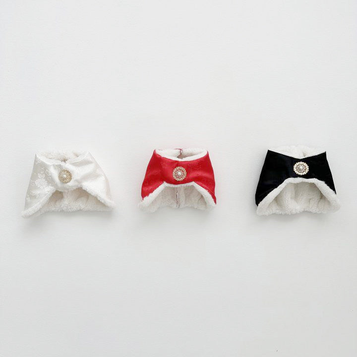 Three baby jobawi bonnets in a row — white, red, and black — displayed against a clean white wall.