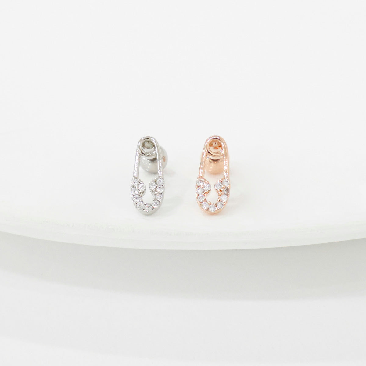 Safety pin barbell earrings in silver and rose gold