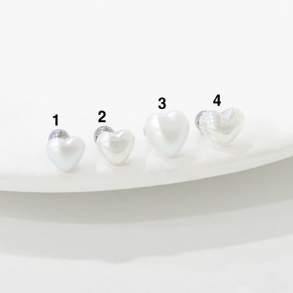 Four sizes of aurora heart pearl barbell studs comparison - sizes 1 through 4"