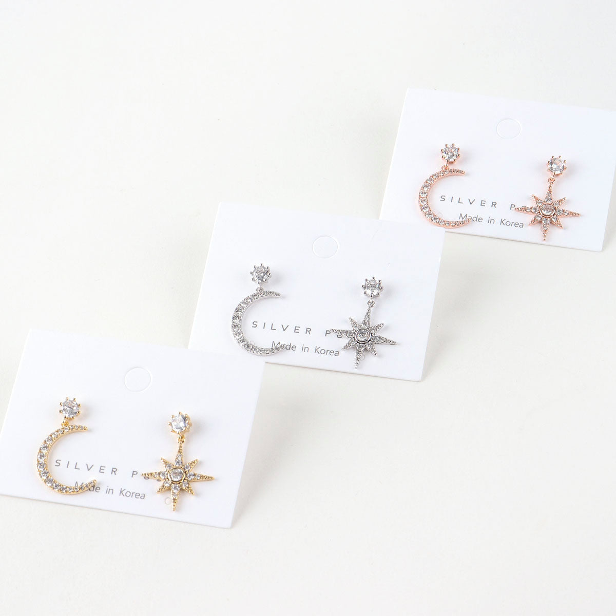 Packaging display of moon star earrings in three colors