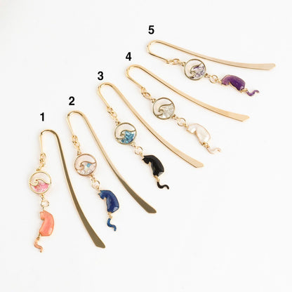 Five handmade cat wave metal bookmarks numbered 1-5 showing pink blue black white purple color options