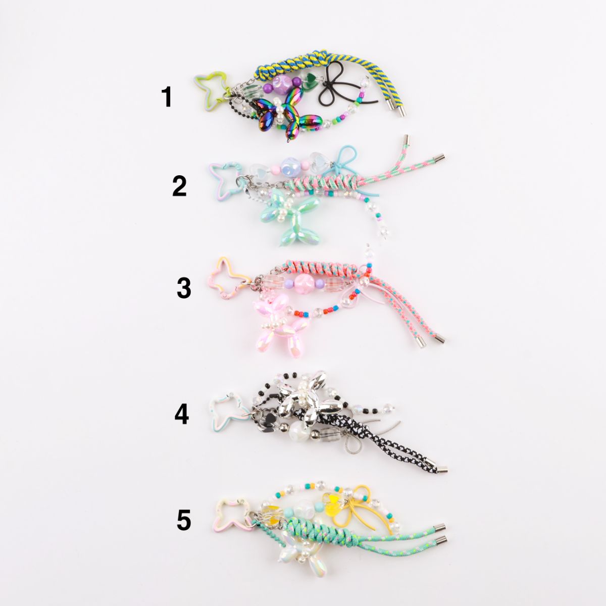 Five color options handmade balloon dog rope keychains flat lay comparison