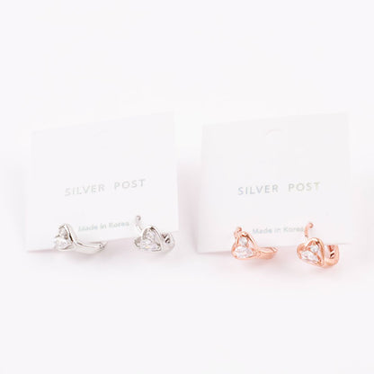 Rose gold and silver heart huggie earrings displayed on jewelry cards labeled "Silver Post" and "Made in Korea."