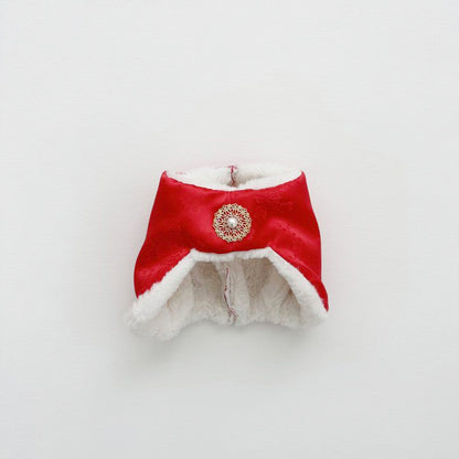 Red satin Korean jobawi with soft white lining and a vintage-style brooch in the center.