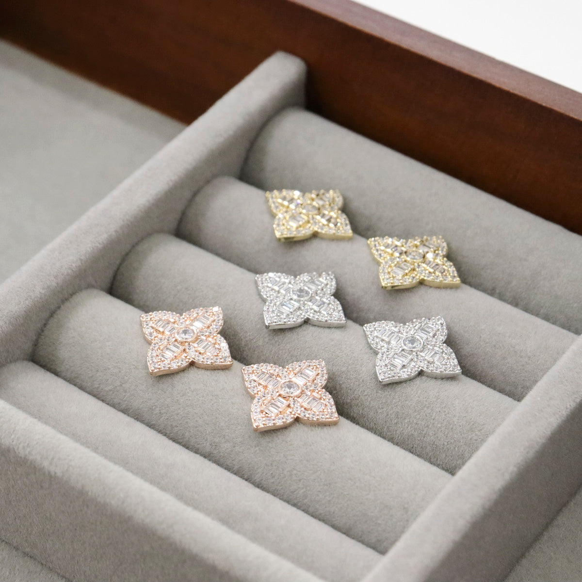 Luxury jewelry box display with all three colors of floral CZ studs