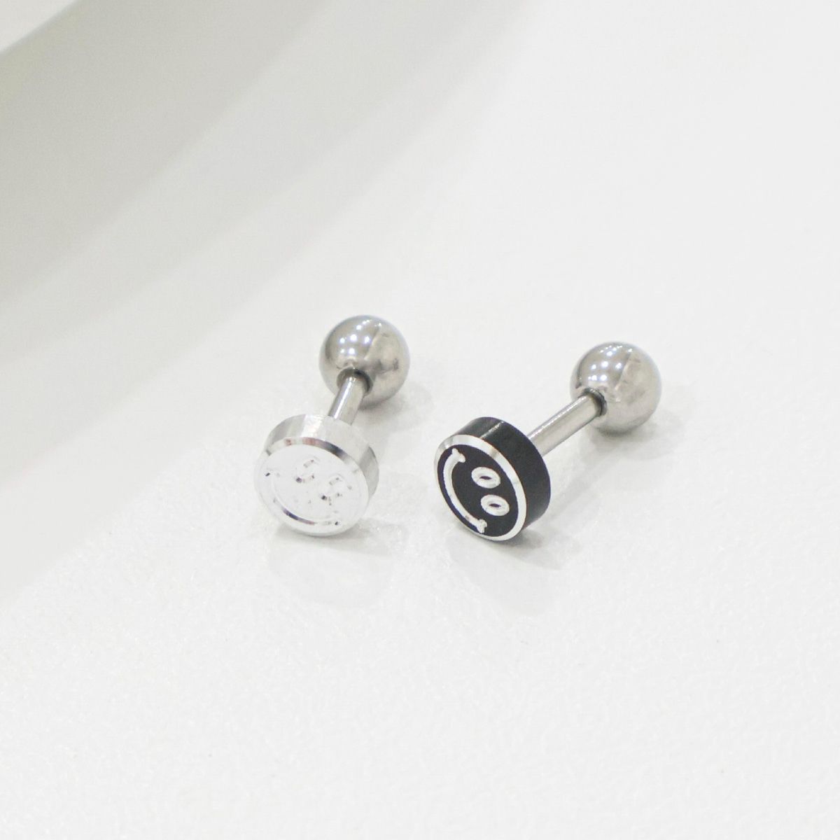  Smiley face studs showing front and back with screw closure