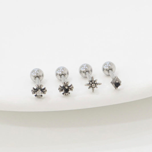 Size comparison image showing three star-themed barbell earrings beside a clear ruler. Focus on length and charm size for accurate product info.